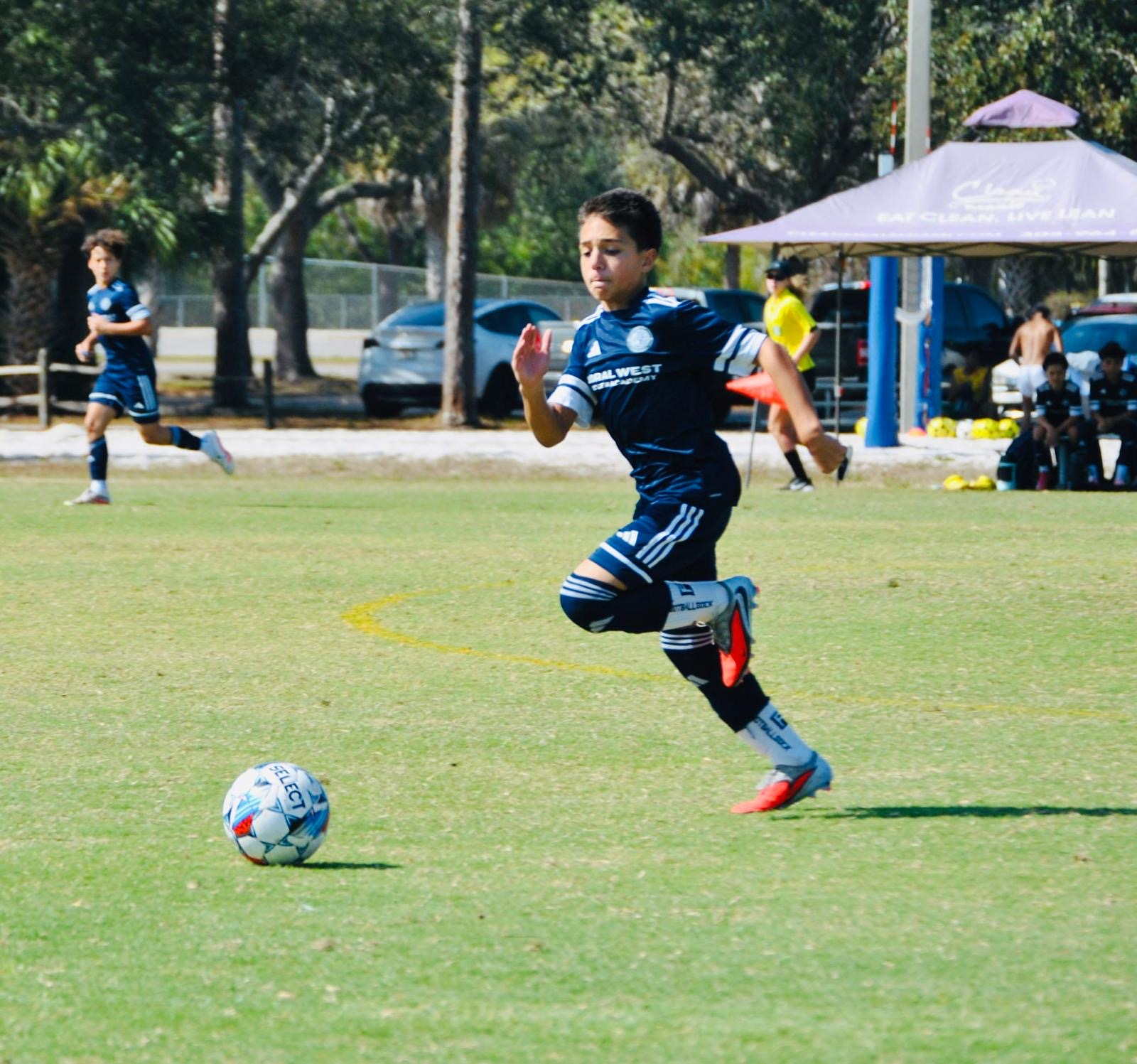 Doral West competitive player carrying the ball during a match