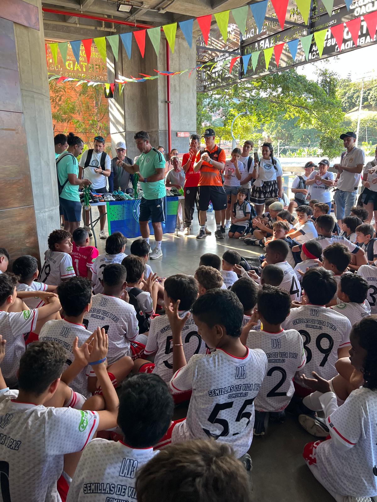 Doral West families presenting contributions to children in Medellín