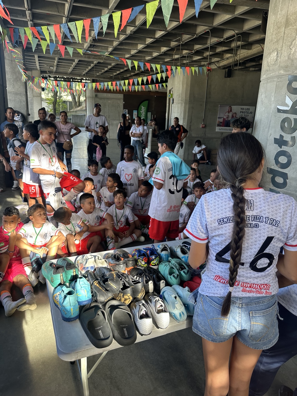 Donated soccer cleats and useful items for children in Medellín
